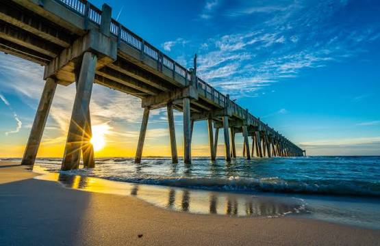 Pensacola Beach fishing pier at sunset over the Gulf